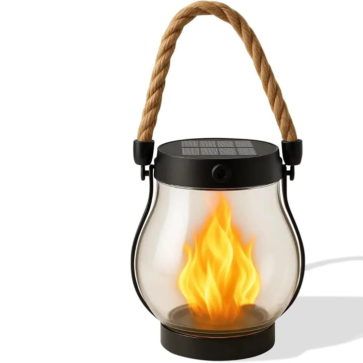 Clear glass lantern with rope handle and flame effect, casting a soft shadow on white 10
