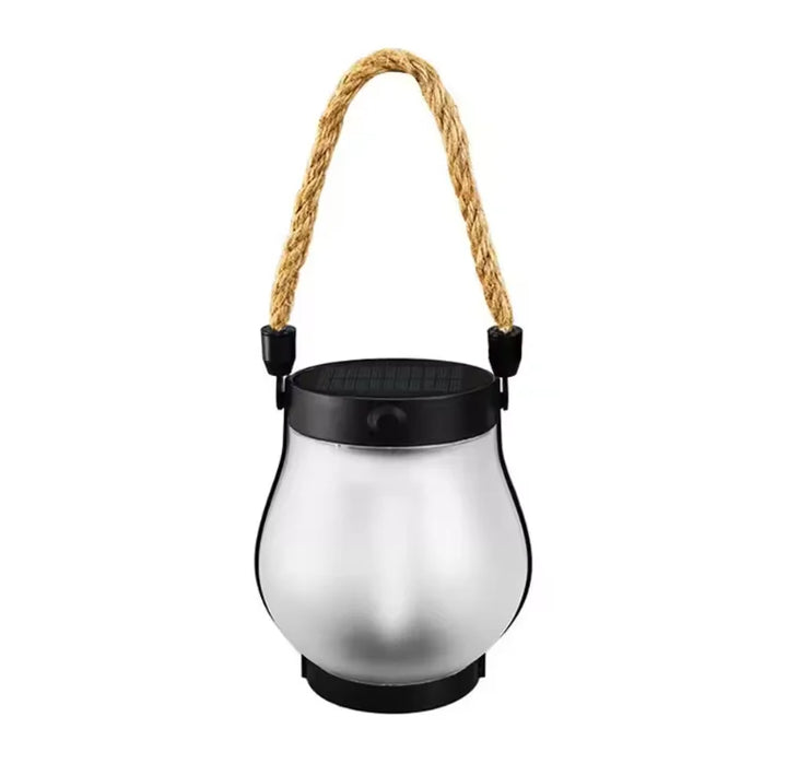Unlit lantern with frosted glass body, black top and rope handle on a white background 11