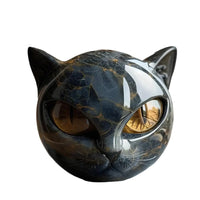 Cutout front view of the glossy black marbled cat head with amber eyes on white 4