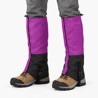 Purple and black gaiters worn over hiking boots on a white background, showing drawcords, side zip and instep straps 8