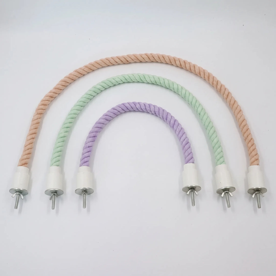 Three twisted cotton rope perches in peach, mint green and lilac, arranged in nested arches, each with white end caps and wing-nut bolts. 1