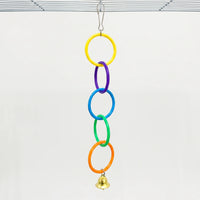 Full five-ring chain in yellow, purple, blue, green and orange with a bell, clipped to a cage roof against a plain background. 6