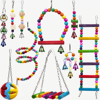 Ten colourful hanging bird toys laid out on white: beaded swing, spiral, ladder, bells, rattan balls, a perch swing and a plastic ball. 1