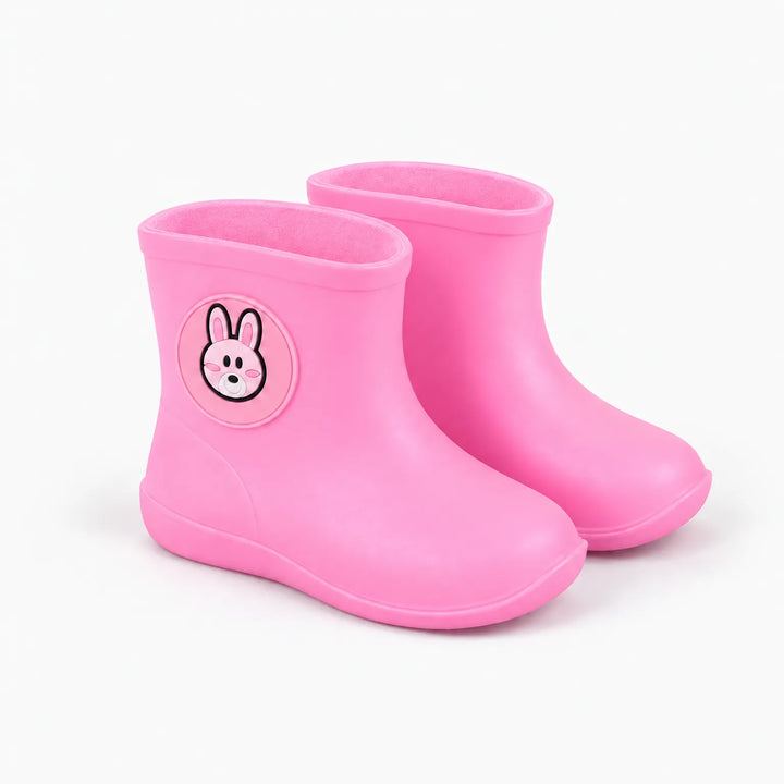 Pair of pink rain boots at an angle, showing the round rabbit badge on the side and the pink lining. 5