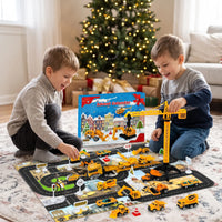 Two smiling boys kneel by a Christmas tree, playing with toy vehicles, a crane and play mat 1