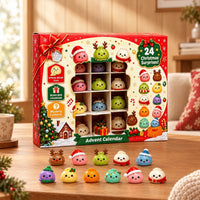 Red festive advent calendar box with a window showing dumpling figures, eleven colorful figures lined up in front on a wooden table. 1