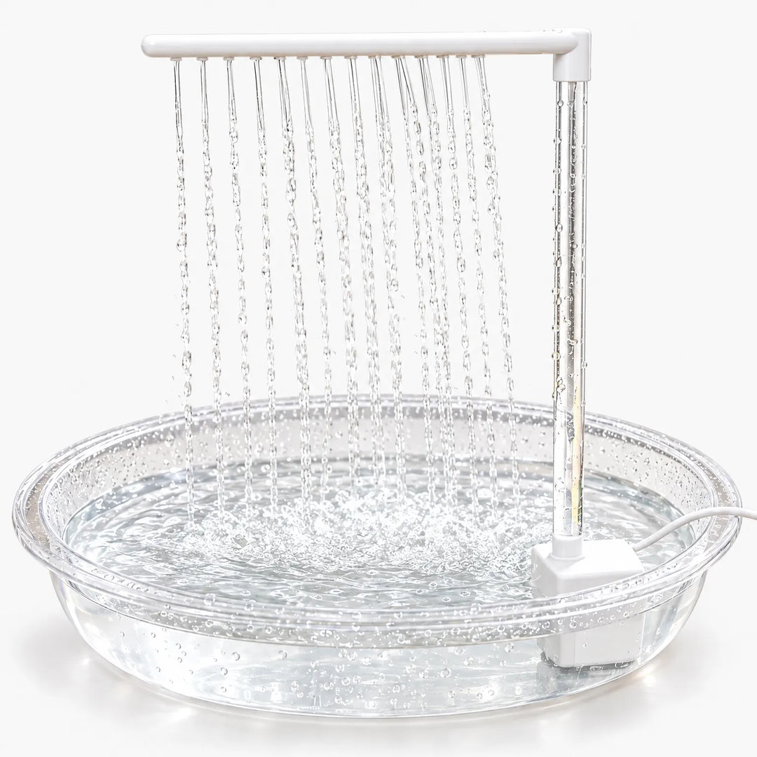 Clear shallow bath with a white pump and overhead bar, rows of water streams falling into the filled dish against a plain white background. 1