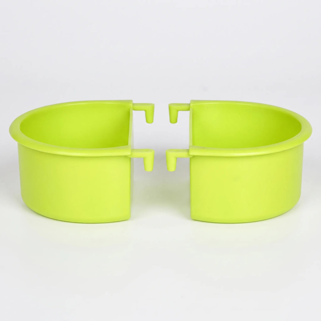 Two green plastic half-round bowls with hook-shaped hangers, shown side by side against a plain light background. 1