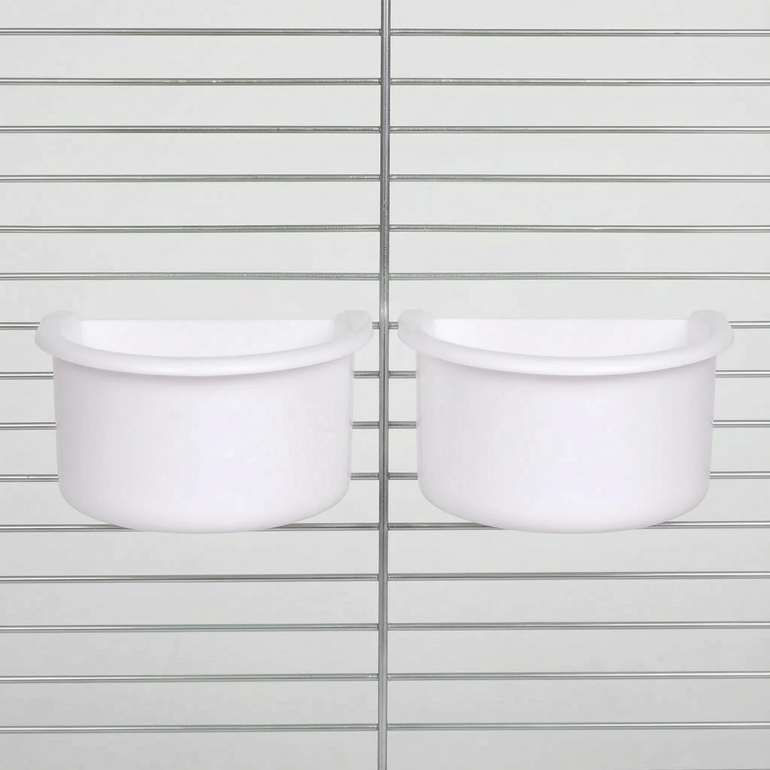 Two white half-round bowls hanging side by side on cage bars, the white version of the same design. 5