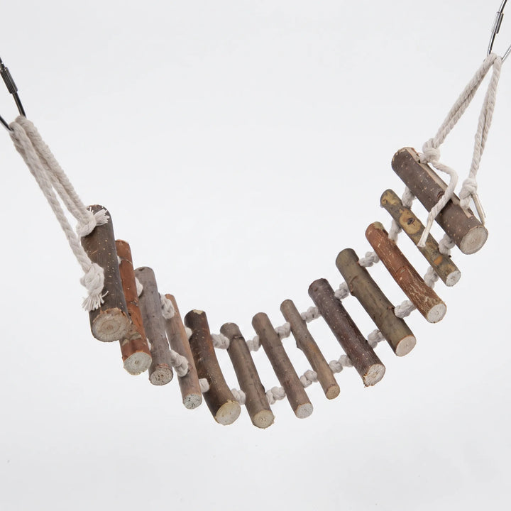 Rope bridge made of natural wooden branch rungs threaded on cream cotton rope, hanging in a curve from metal clips against a plain white background. 1