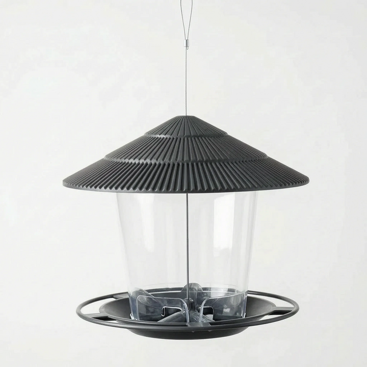 Dark charcoal version hanging empty, viewed slightly from above to show the feeding tray and seed openings inside the clear container. 5