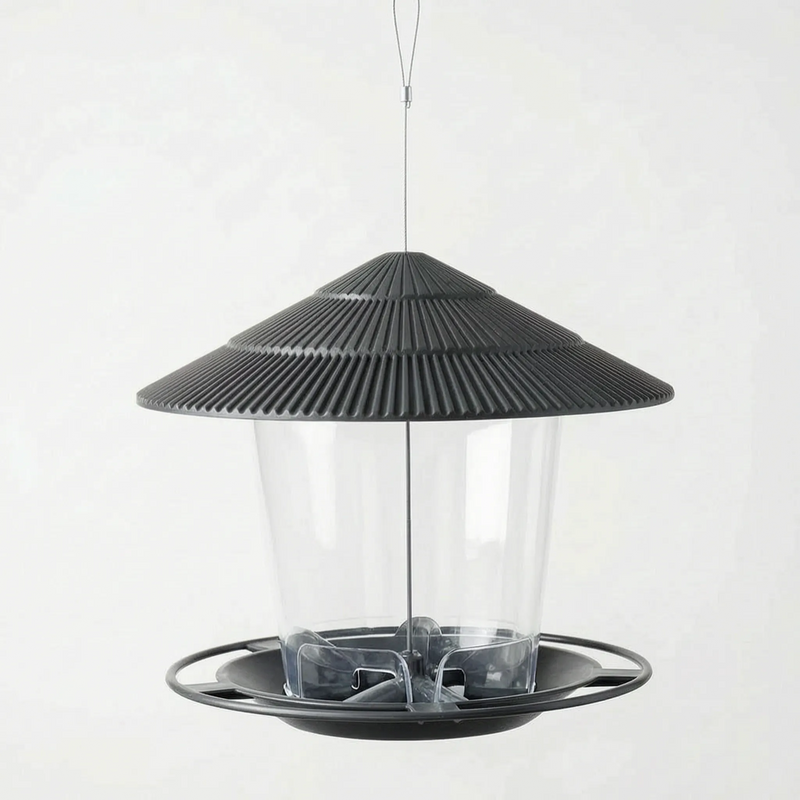 Dark charcoal version hanging empty, viewed slightly from above to show the feeding tray and seed openings inside the clear container. 5