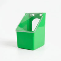 Single-compartment feeder seen from a three-quarter angle against a white background, with its clear hinged lid closed and the arched opening visible behind it. 4