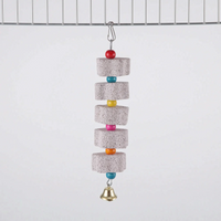 Longest version with five stone blocks separated by red, blue, yellow, pink, orange and blue beads, ending in a bell, clipped to cage wire. 9