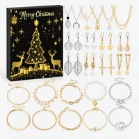 Black and gold Christmas box with reindeer and tree, displayed beside gold and silver necklaces, drop earrings and bracelets with pearls and charms. 5