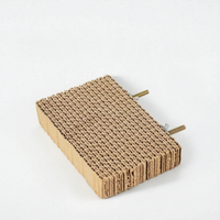 Smaller rectangular cardboard platform without corks, with two threaded bolts and fixings sticking out from the back edge. 7