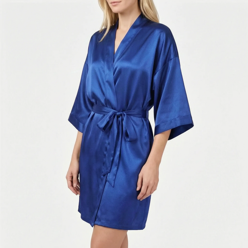 Robe in royal blue on a blonde model, shown at an angle with the belt knotted at the waist. 12