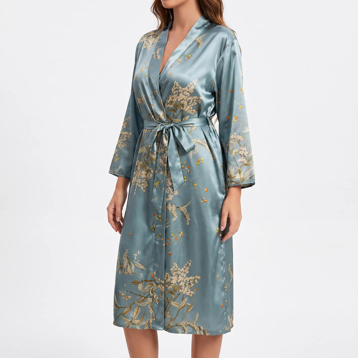 Side view of the teal satin robe with belt tied in a bow, showing the V-neck and flared sleeves. 7