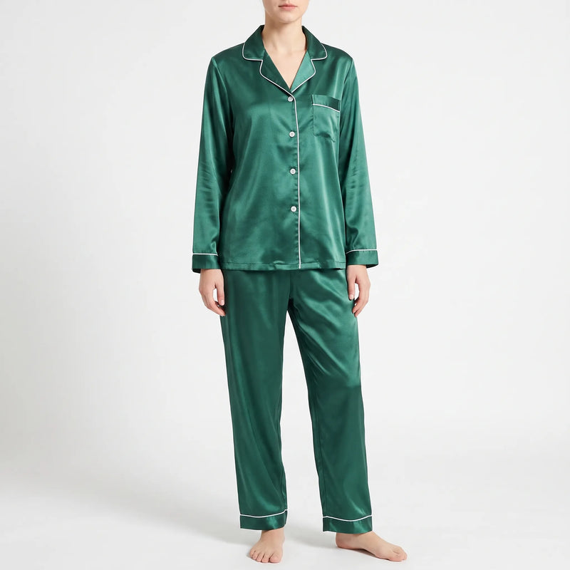 Front view of the green satin pyjama set with white piping, worn by a model on a light grey background. 12