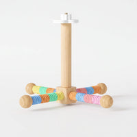 Perch version with rainbow-coloured rope wrapped around the four arms in yellow, green, orange, blue and pink sections. 4