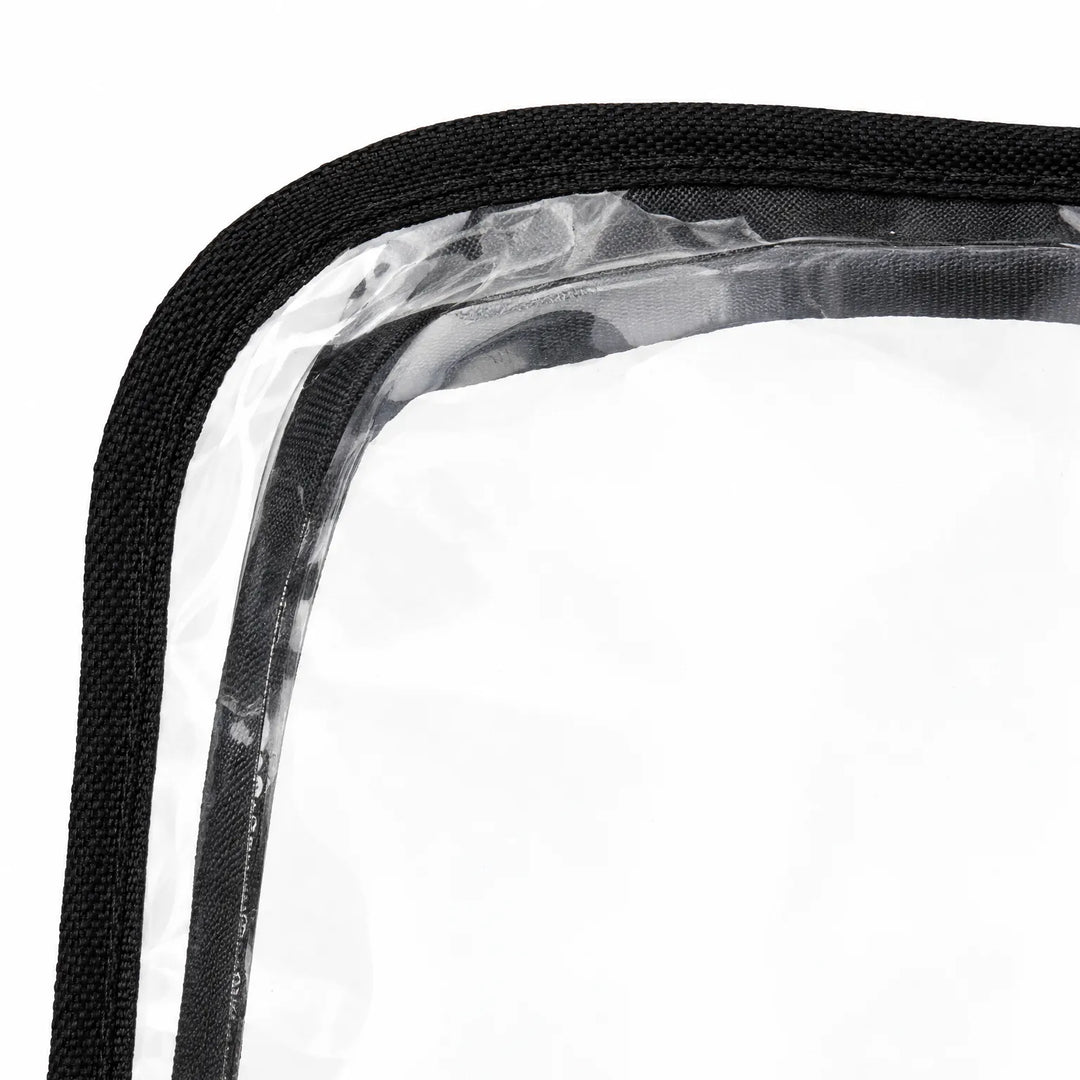 Close-up of a muff corner showing clear plastic panel edged with woven black binding on a white background. 5