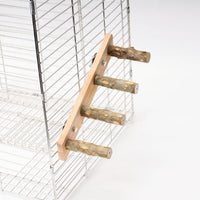 Four-rung wooden ladder with natural bark-covered branch rungs, bolted to the outside of a white wire cage on a plain background. 1