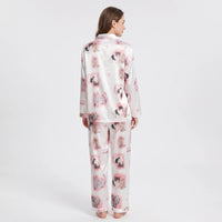 Back view of a model wearing the satin pyjama set, showing the kitten print across the shirt and trousers. 3