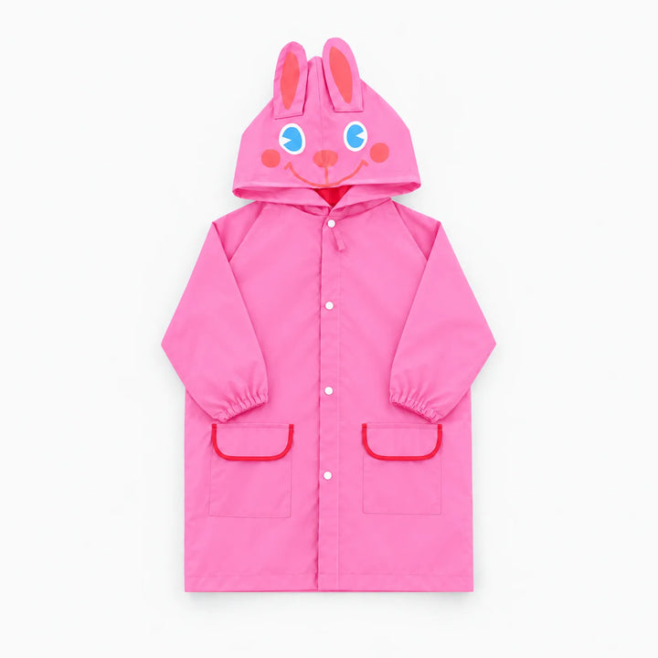 Pink rabbit rain jacket laid flat, with ears and a smiling face on the hood and red-trimmed pockets. 9
