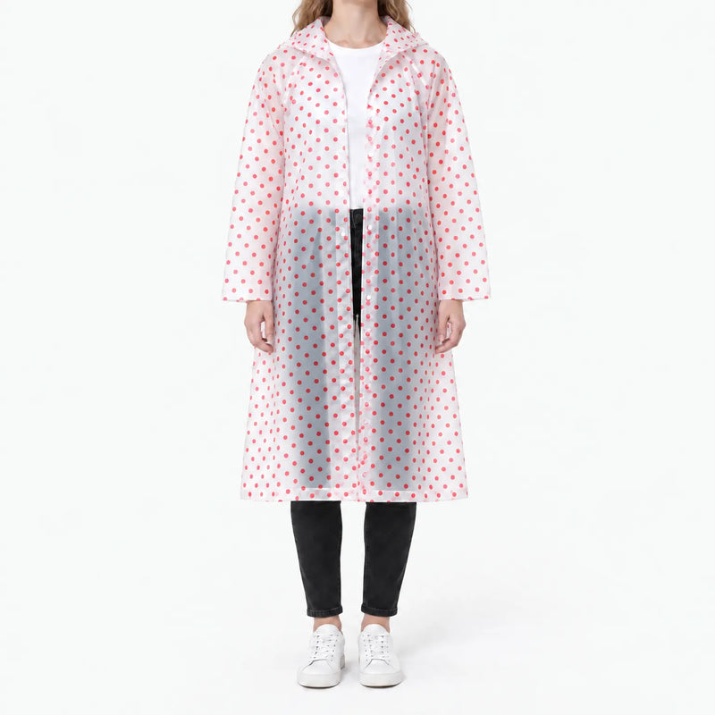 Front view of the translucent raincoat with red polka dots, snap buttons visible, worn over a white tee and black jeans. 10