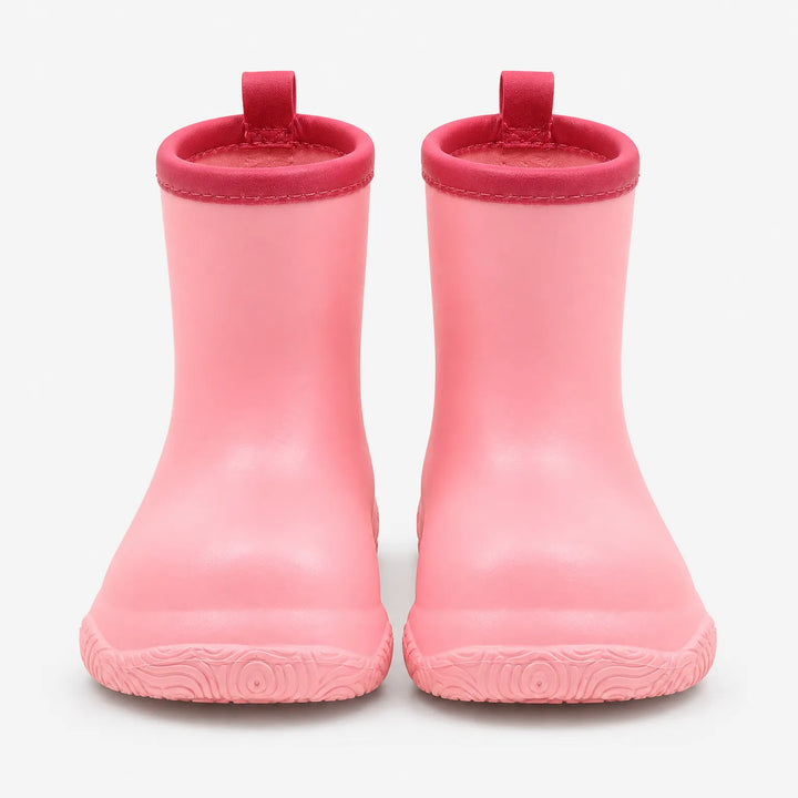 Front view of a pair of pink pull-on wellies with deeper pink stitched collars, loops and a patterned sole. 5