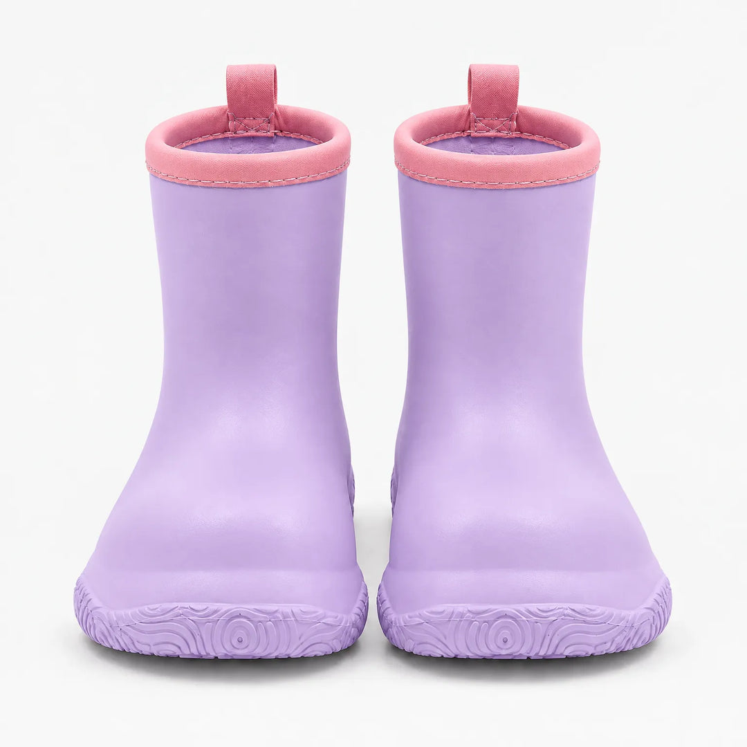Front view of a pair of lilac wellies with pink stitched collars, pull loops and a swirl-patterned sole. 9