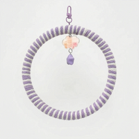Ring swing wrapped in lilac and white rope, with a lilac clip, a pastel iridescent cloud charm and a purple star bead. 7