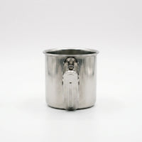 Back view of a steel cup showing the flat spring clip fixed to its side with two rivets. 4