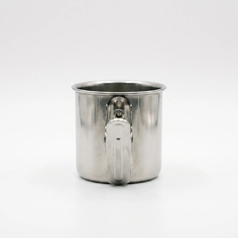 Back view of a steel cup showing the flat spring clip fixed to its side with two rivets. 4