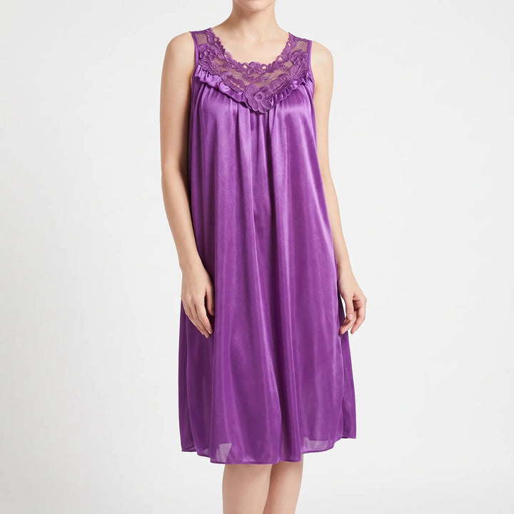 Front view of the purple satin nightgown on a model against white, showing the embroidered lace neckline and ruffle trim. 2