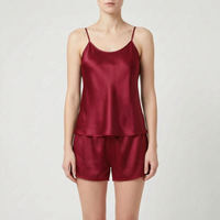Front view of the camisole and shorts set in dark burgundy satin worn by a model. 12