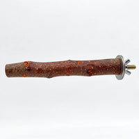 Natural wooden bird perch with textured bark, knots and a metal washer, wing nut and threaded bolt at one end, on white. 1