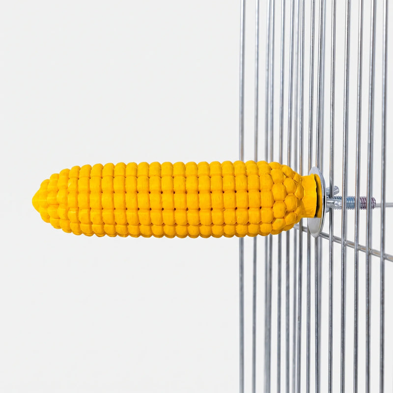 Side view of the yellow corn cob perch bolted to a wire cage with a washer and wing nut. 1
