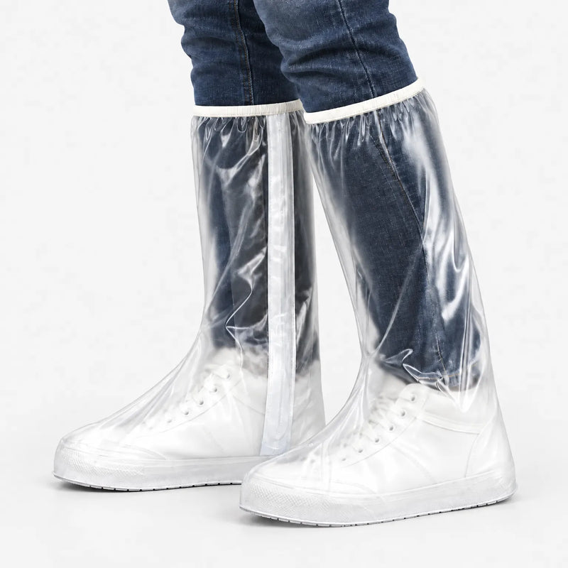 Side angle of clear tall overshoes with white trim and a vertical white strip, worn over white sneakers and jeans on a light background. 5