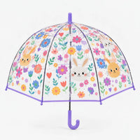 Clear dome umbrella with lilac trim and handle, printed with bunny faces, colorful flowers, tulips and hearts, front view on white background. 11