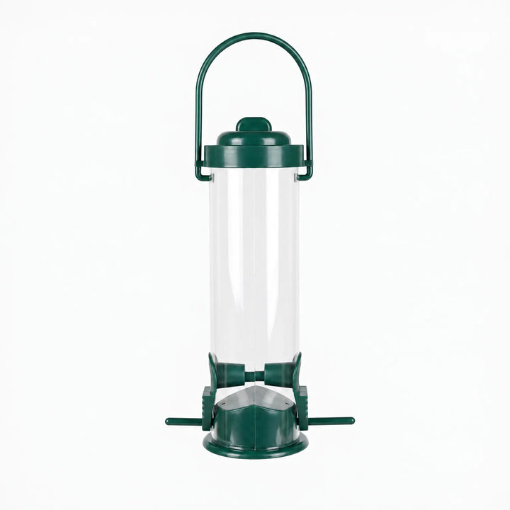 Empty clear tube bird feeder with dark green lid, arched carry handle, two feeding ports and small perches, shown against white. 1