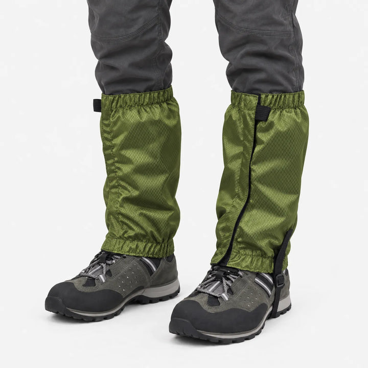 Olive green ripstop gaiters with elastic cuffs and under-boot strap, worn over grey hiking shoes against a plain white background. 2