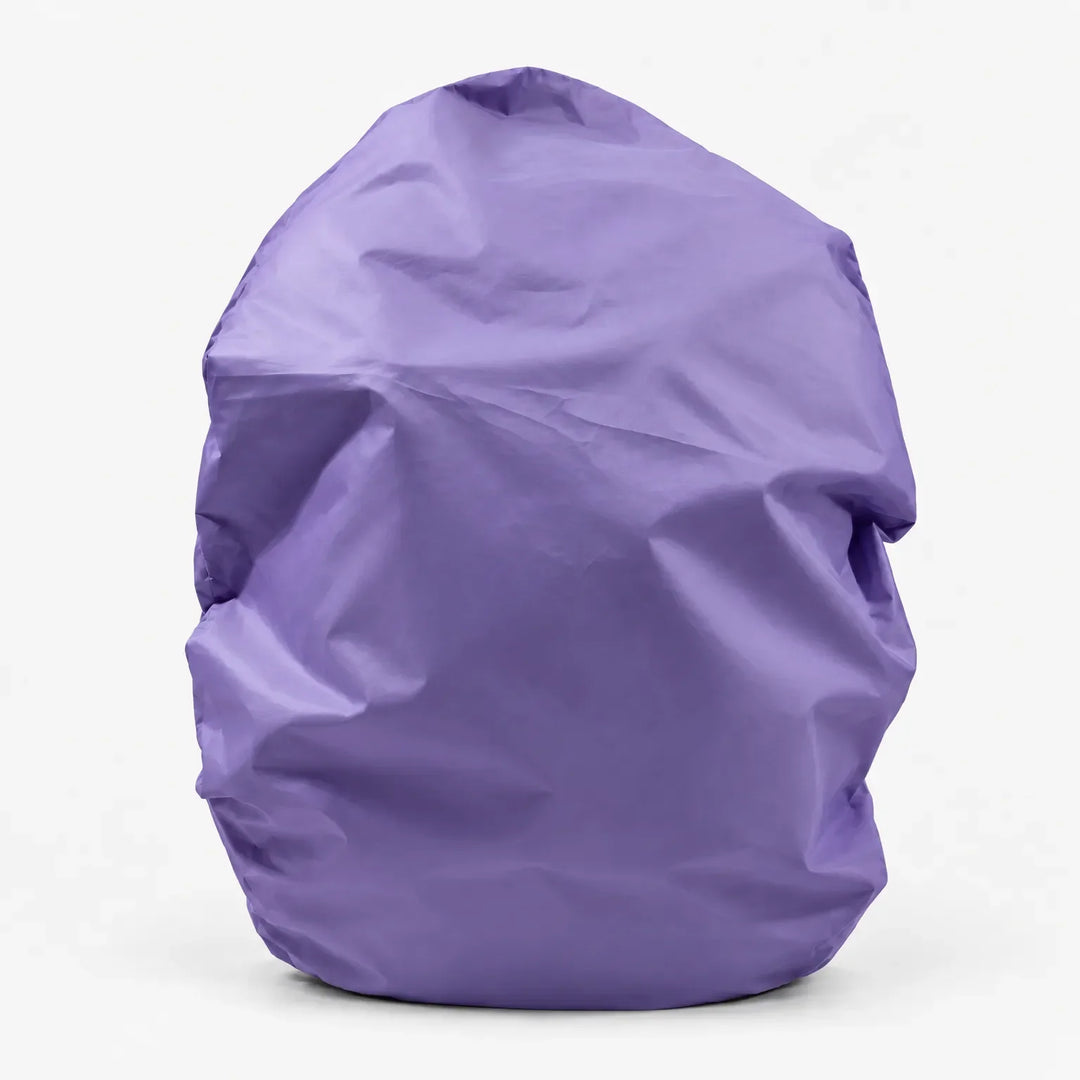 Lilac purple rucksack cover pulled over a bag, shown from the front against a plain white background. 14