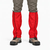 Front view of red gaiters worn over hiking boots with olive trousers, showing side zips, snap fasteners and drawcord tops. 8