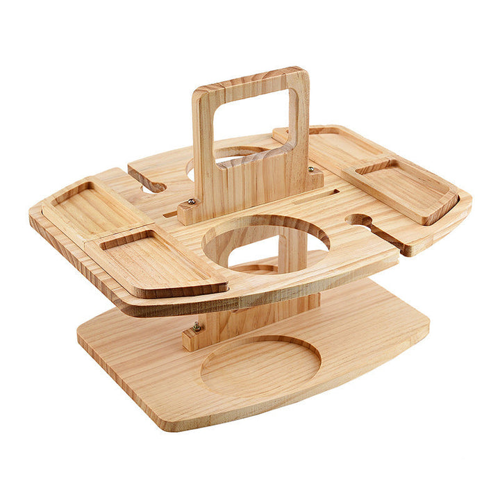 Unfolded light pine table with empty snack trays, bottle holder, glass slots and carry handle on white background 4