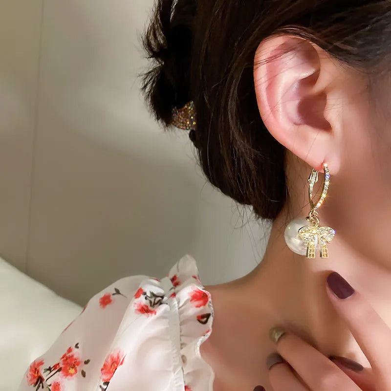 CHRISTMAS PEARL AND BOW EARRINGS-BEIGE-State of Style