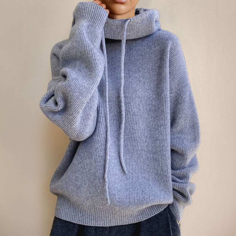 Light blue-grey oversized jumper with a cowl neck, drawstrings and dropped shoulders, hand at collar 6