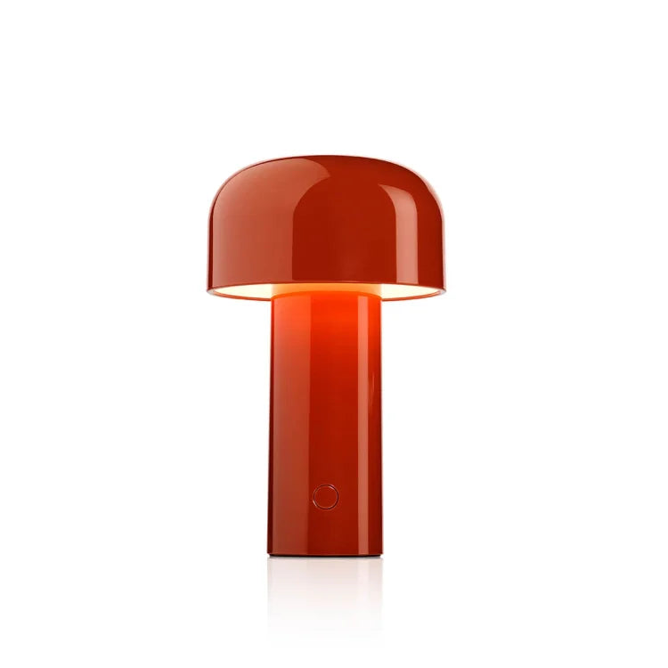 Glossy red-orange mushroom lamp lit up against a plain white background, with a button on the stem 3