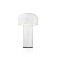 White glossy mushroom lamp glowing softly against a plain white background, with round button on the base 2